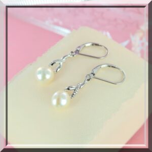 Magnifique paire de Boucles d'oreilles argent pendante perle eau douce.
